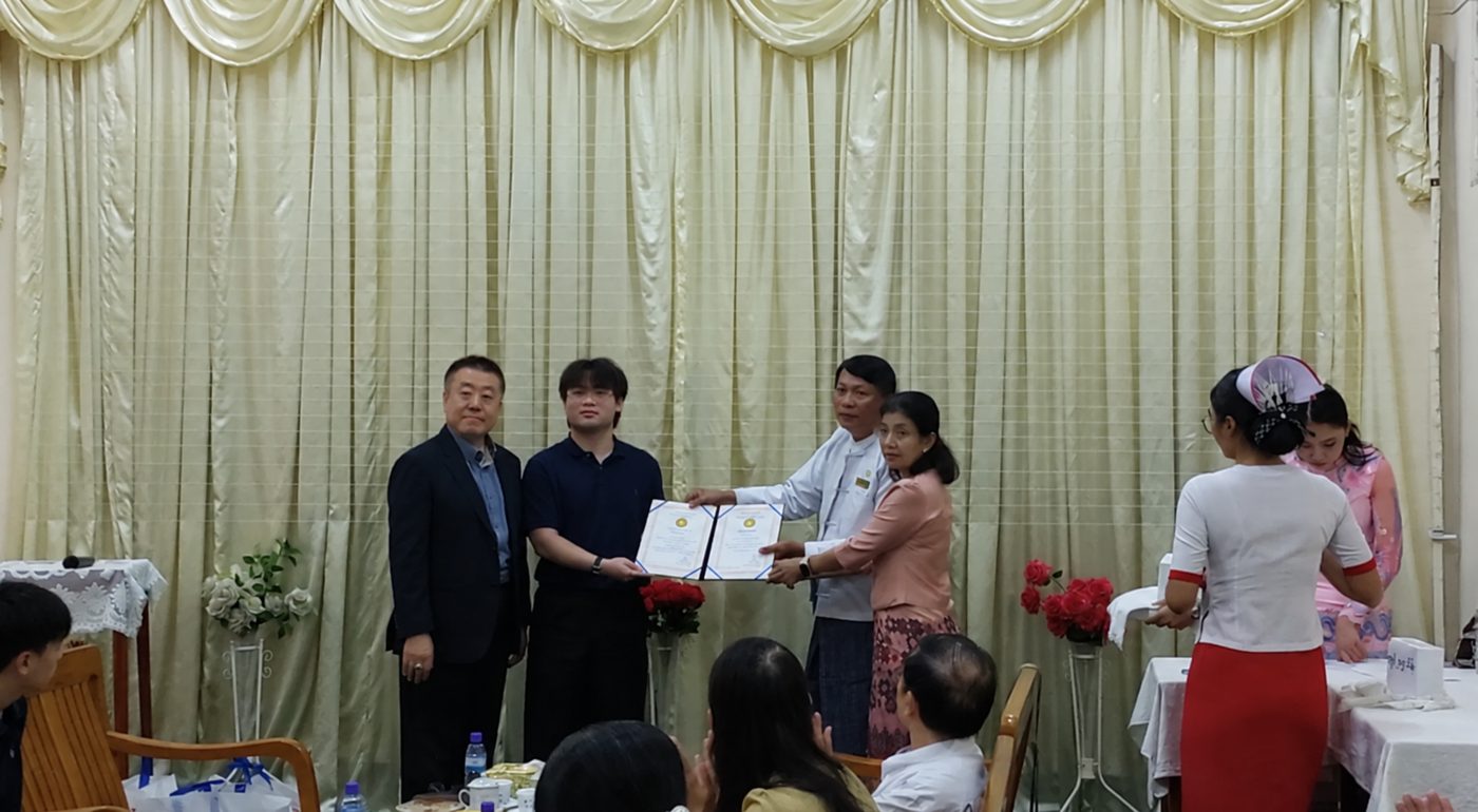 Receiving a certificate of appreciation from the hospital