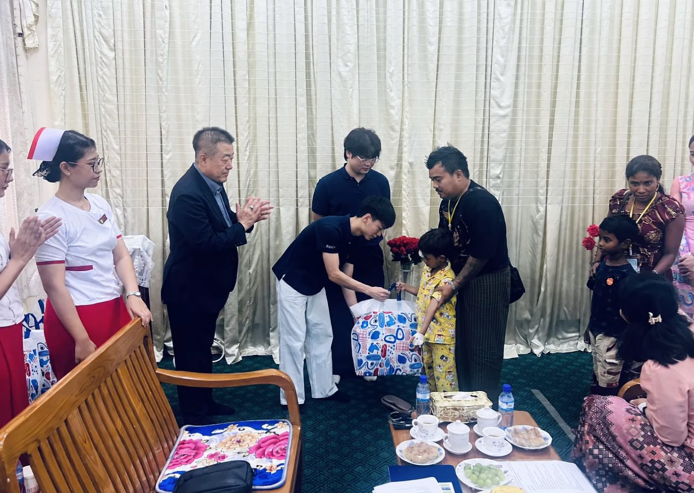 Handing a gift to one of the children